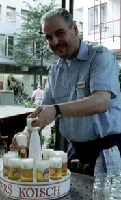 A Cologne waiter, "Koebes" at work.